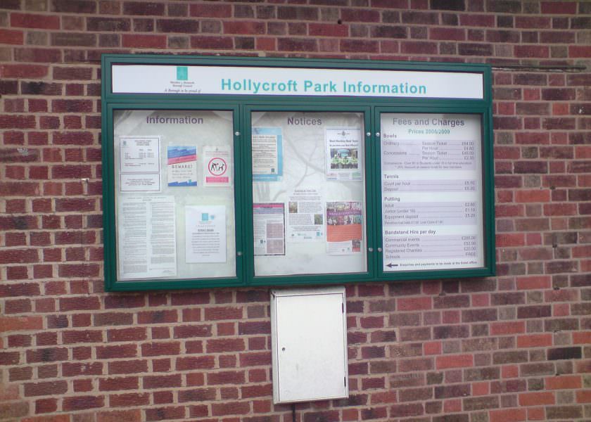A wall-mounted outdoor information notice board with 3 lockable doors and a separate header panel. Produced in aluminium with a pinboard backer. Wall mounted.