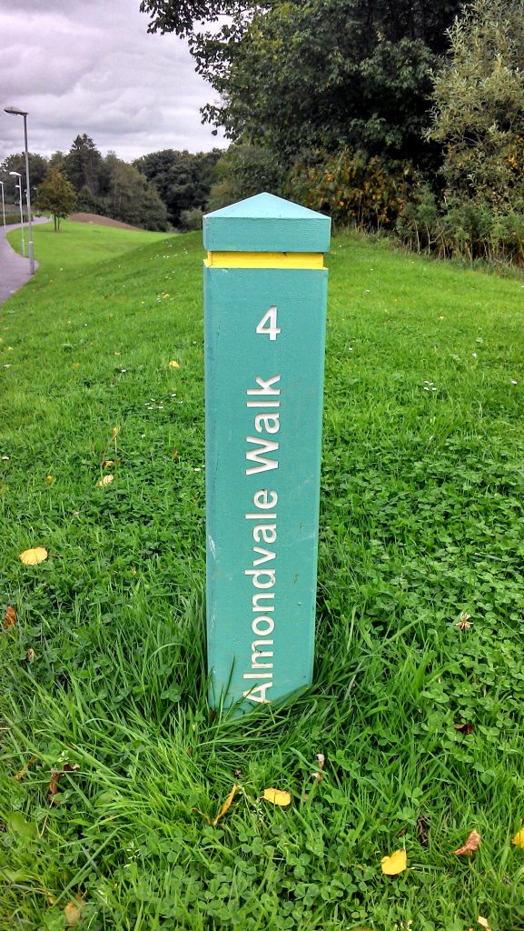 Painted bollard showing park walk route