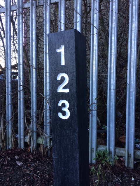 Recycled plastic bollard with routed numbers